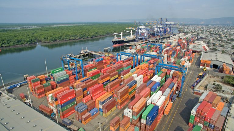 Shipping containers at port © Unsplash