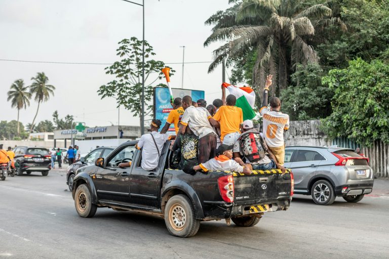 Ivory Coast supporters of a political party on the street. Photo by Yanick Folly @ Unsplash
