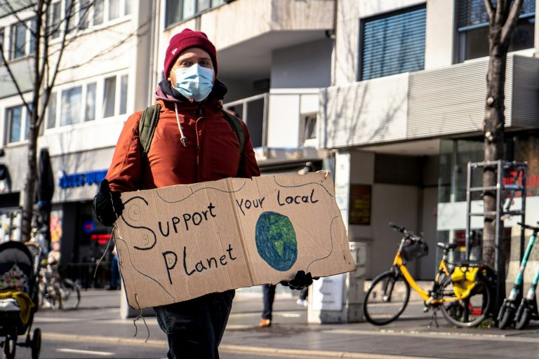 Activist campaign for safer climate across the globe. Photo by Mika Baumeister @ Unsplash