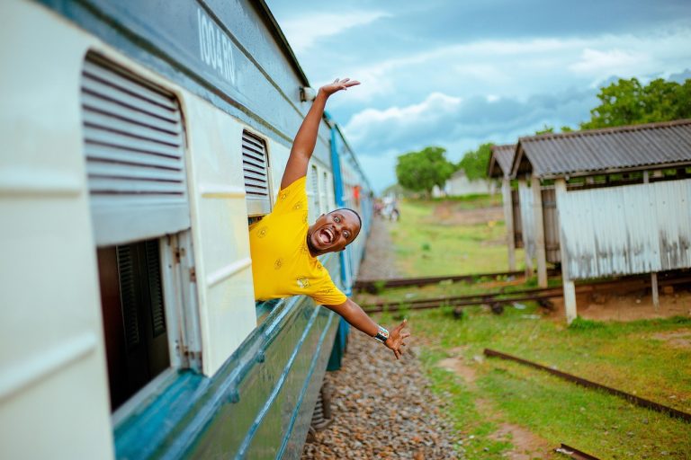 An excited train passenger in Tanzania. Photo by Pixabay
