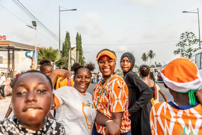 Happy Ivorian citizens on the street. Photo by Yanick Folly @ Unsplash