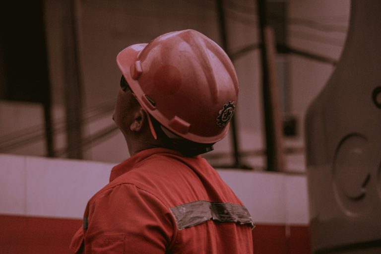 An oil worker on the field. Photo by Chintya Akemi Keirayuki @ Unsplash