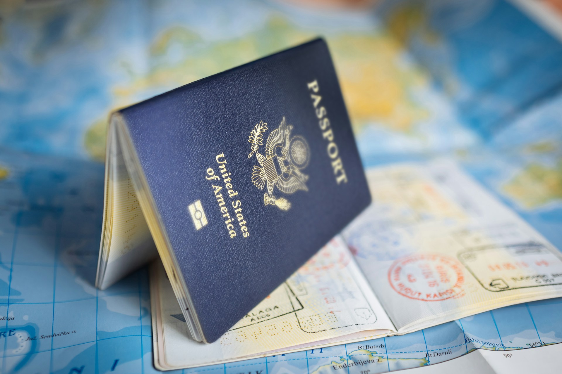 US passport and visa on display. Photo by Global Residence Index @ Unsplash