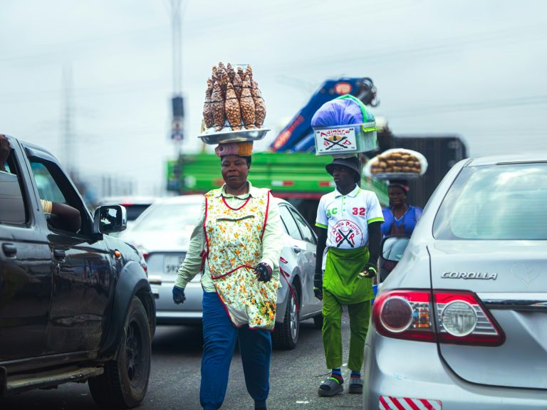 Women hawkers on the streets of Accra, Ghana. Photo by Langford Kwabena @ Unsplash