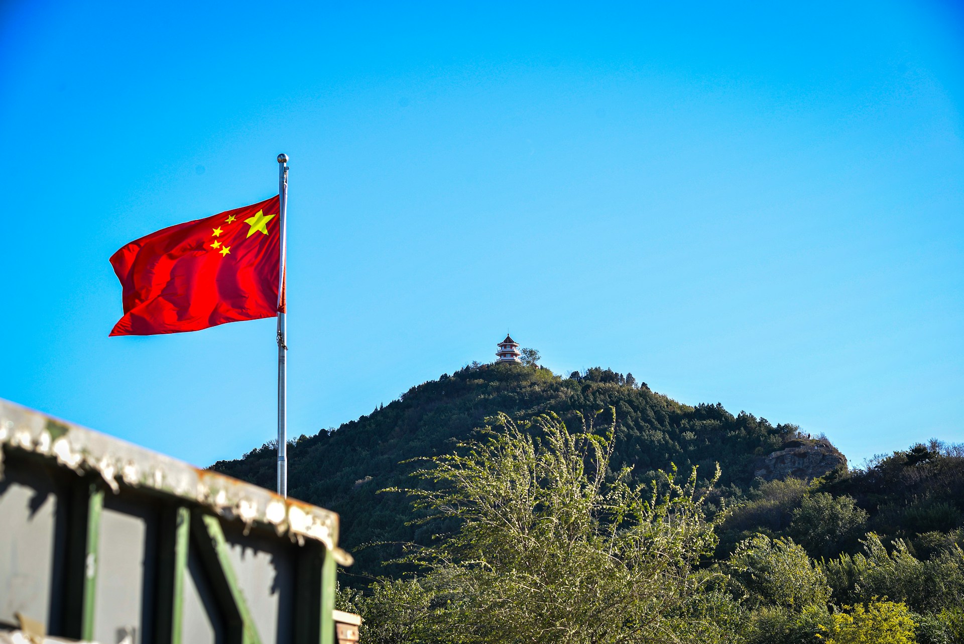 A flag of China. Photo by Bo Peng @ Unsplash