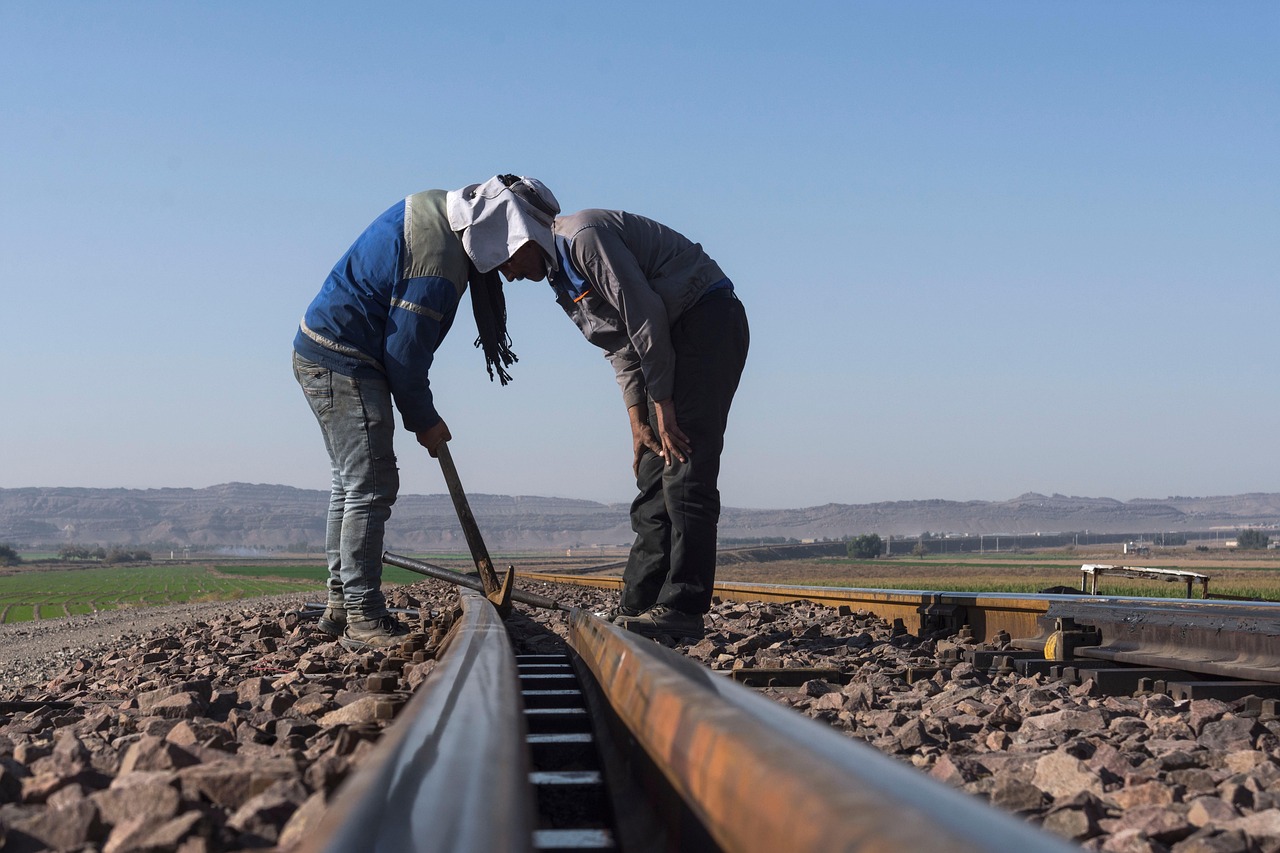 Railway workers inspecting a rail track. Photo by Javad Esmaeili @ Pixabay