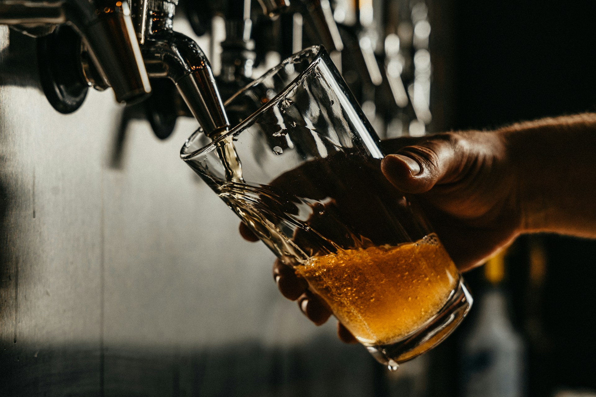 Beer in glass. Photo by Josh Olalde @ Unsplash
