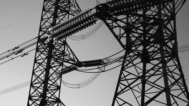 Electricity transmission line. Photo by Sherise Van Dyk @ Unsplash