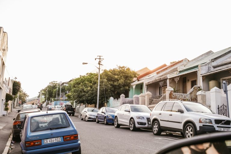 Parked cars in a community. Photo by Sincerely Media @ Unsplash