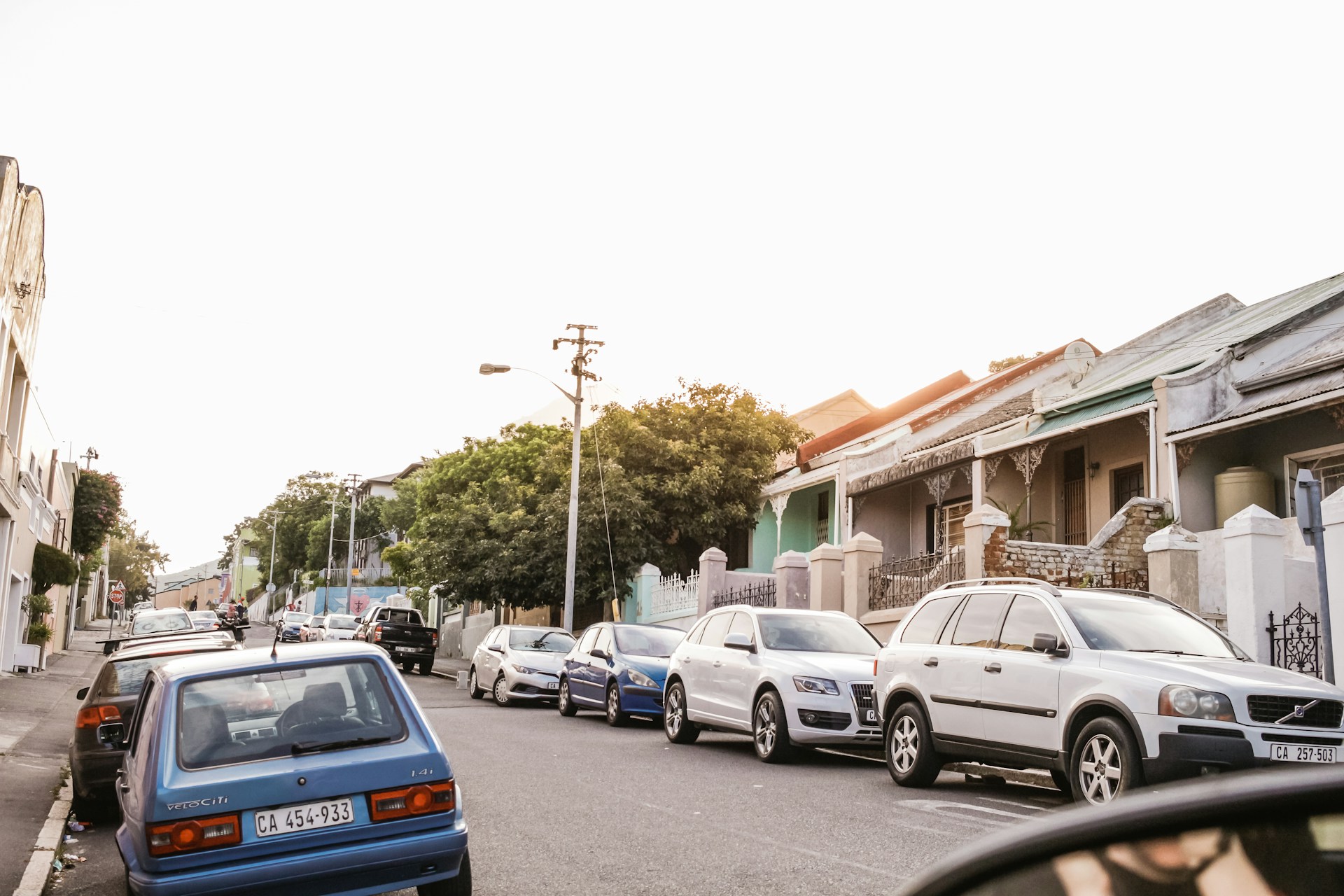 Parked cars in a community. Photo by Sincerely Media @ Unsplash
