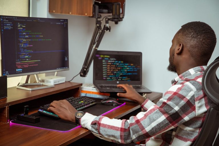 A young African tech enthusiast at work. Photo by Naboth Otieno @Pexels.