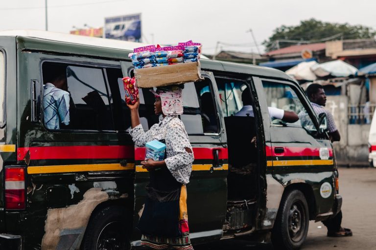 Street vendor selling goods in traffic in Ghana. Photo by Carbell Sarfo @Pexels