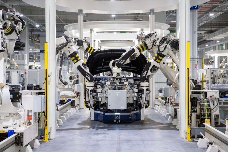 High-tech robots assembling a car in a modern factory setting, showcasing automation. Photo @ Pexels