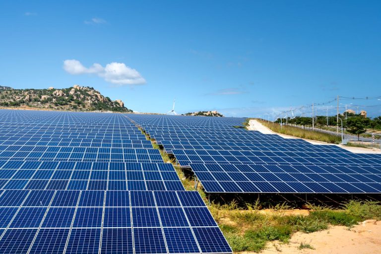 A vast array of solar panels, symbolising renewable energy. Photo by Quang Nguyen Vinh @ Pexels
