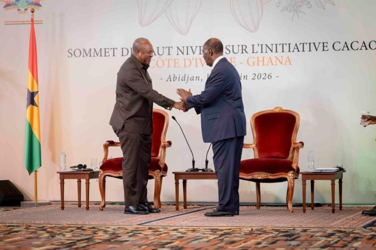 Ghana President John Mahama (L) in a handshake with Alassane Ouattara of Ivory Coast. Photo: Office of the President/Ghana