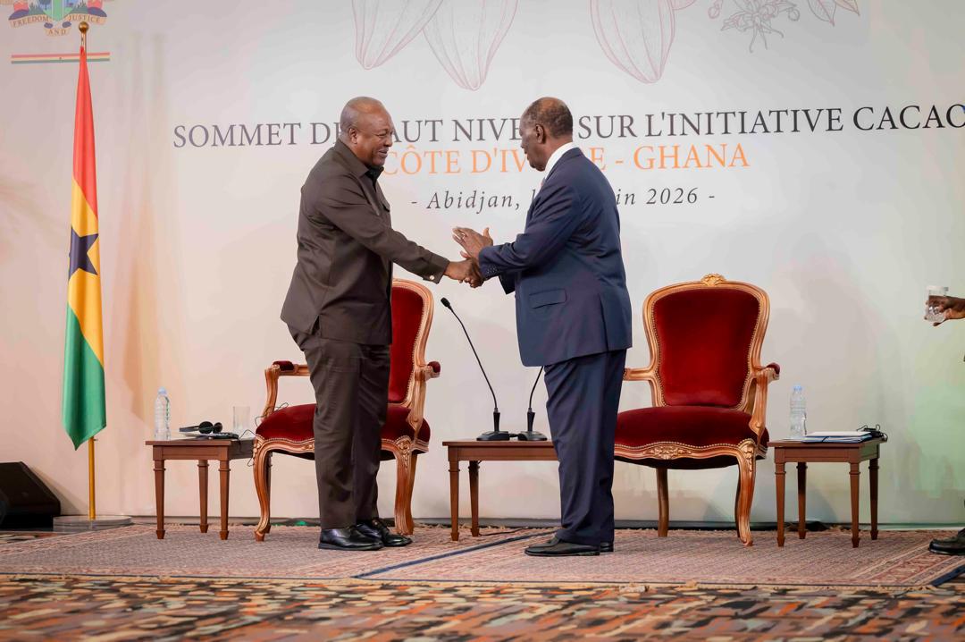 Ghana President John Mahama (L) in a handshake with Alassane Ouattara of Ivory Coast. Photo: Office of the President/Ghana