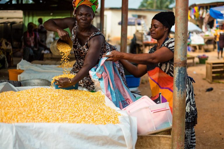 Two women selling corn at an outdoor market in Accra, Ghana. @Pexels