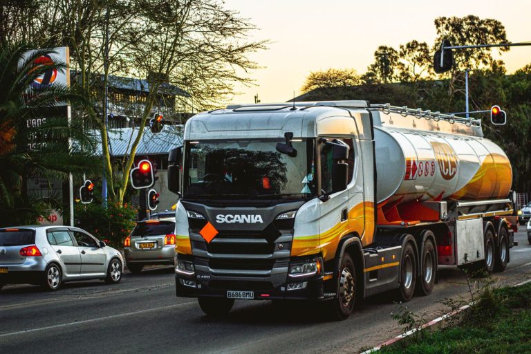 Fuel tanker truck navigating city roads. Photo @ Pexels