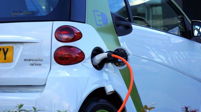 An electric car being charged. Photo by Mike Bird @ Pexels