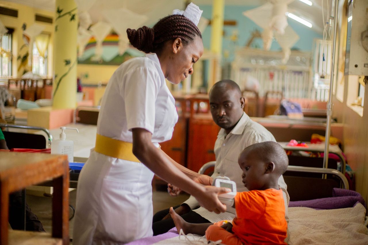 A nurse attends to a young patient. Photo by Speak Media Uganda @ Pexels