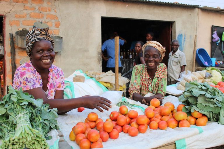 Women selling at the market. Photo by Ana Kenk @ Pexels