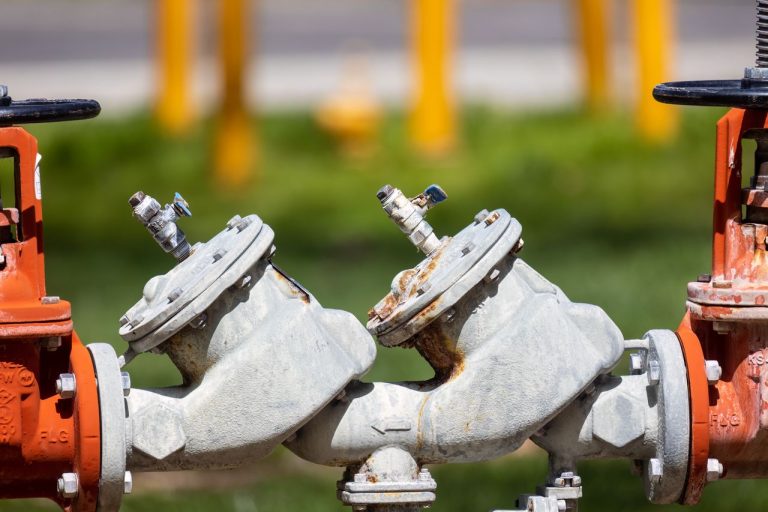 Industrial gas valves outdoors. Photo by David Brown @ Pexels